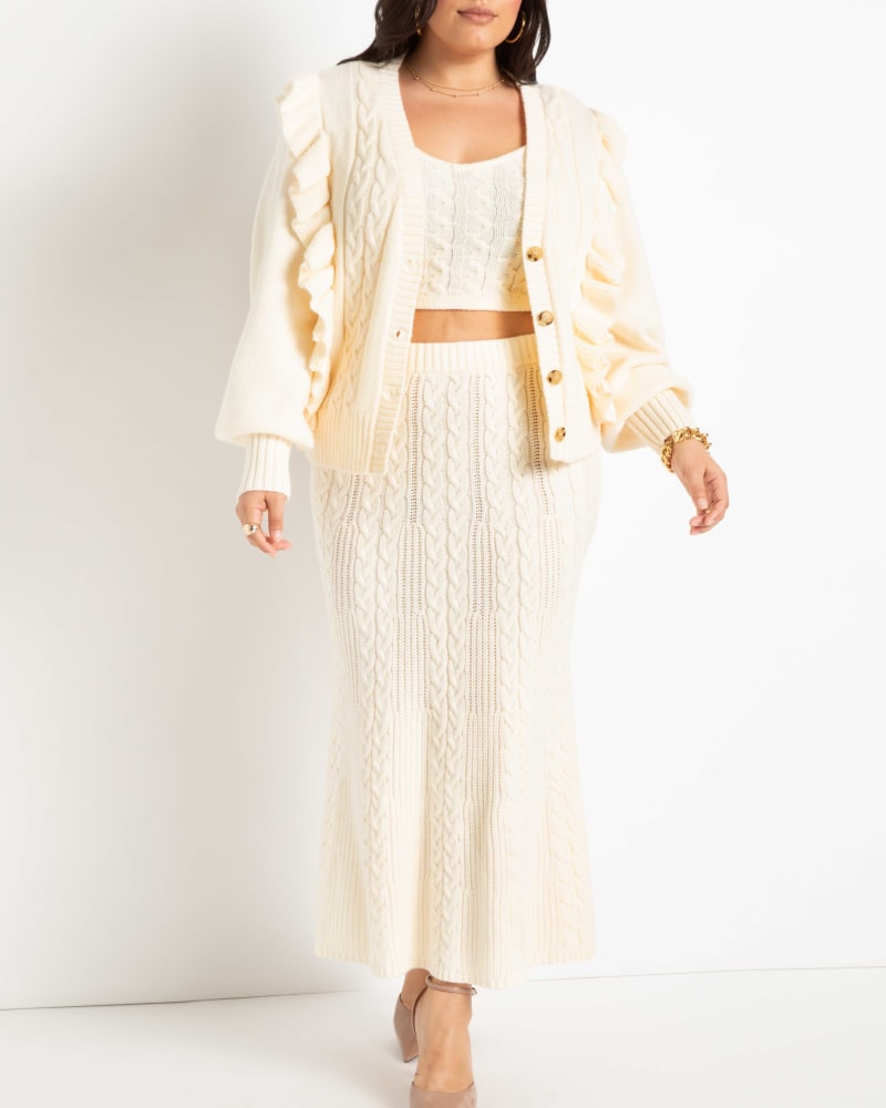 Front of a model wearing a size 14/16 Shayla Cable Knit Sweater Midi Skirt in Pristine by ELOQUII. | dia_product_style_image_id:236440